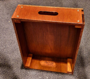Showing the inside of the box standing on end for use as a seat